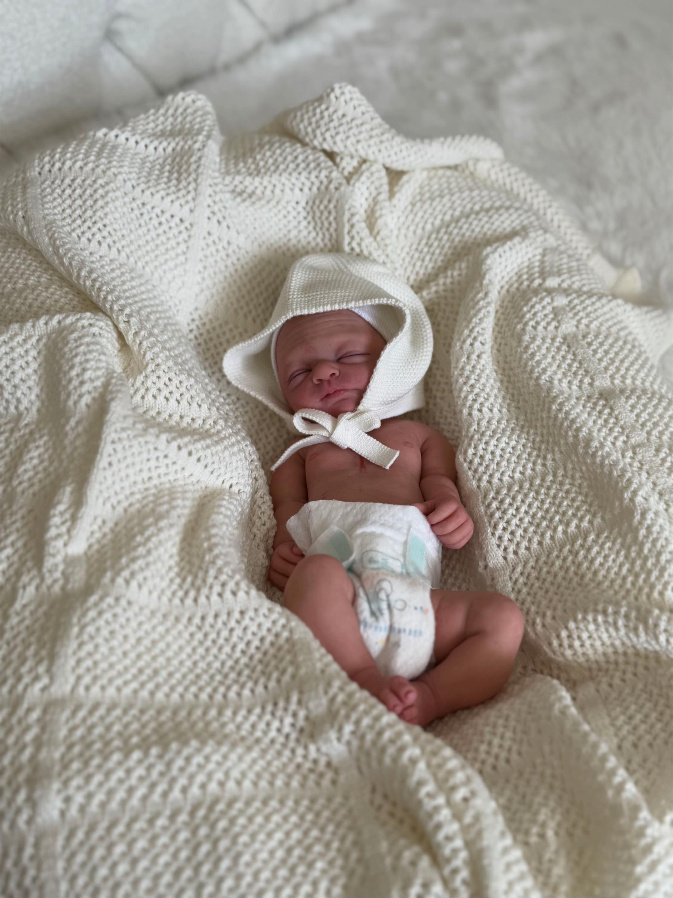 Anatomically neutral realistic reborn baby dolls for custom nursery collectors by Reborn Heaven.