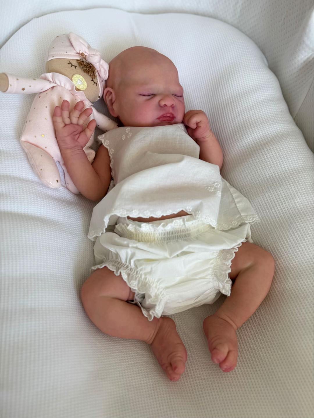 Baby Chloe, an 18.9-inch realistic full body silicone drink and wet reborn baby doll girl with a sleeping expression by Reborn Heave